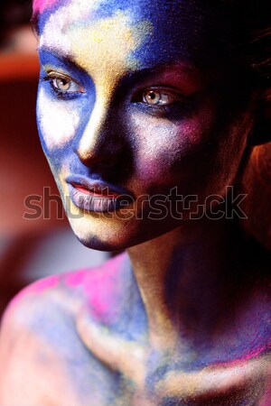 woman with creative makeup closeup like drops of colors, facepai Stock photo © iordani
