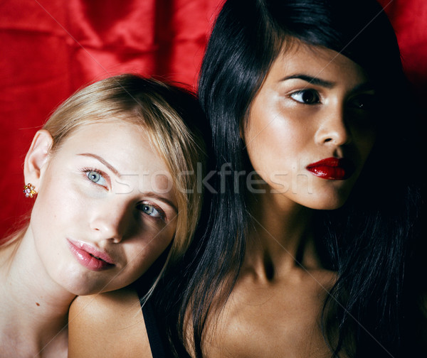 blonde woman vs brunette Stock photo © iordani