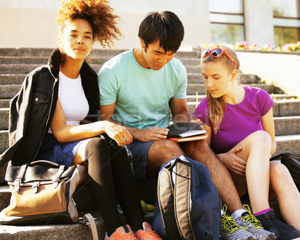 Stock photo: cute group of teenages at the building of university with books huggings, diversity nations