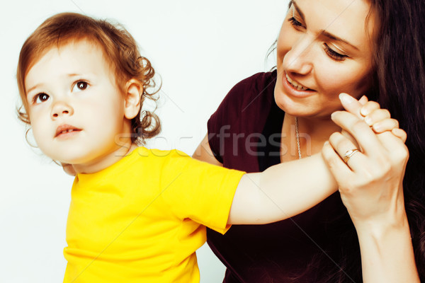 pretty real normal mother with cute blond little daughter close up isolated on white background, lif Stock photo © iordani
