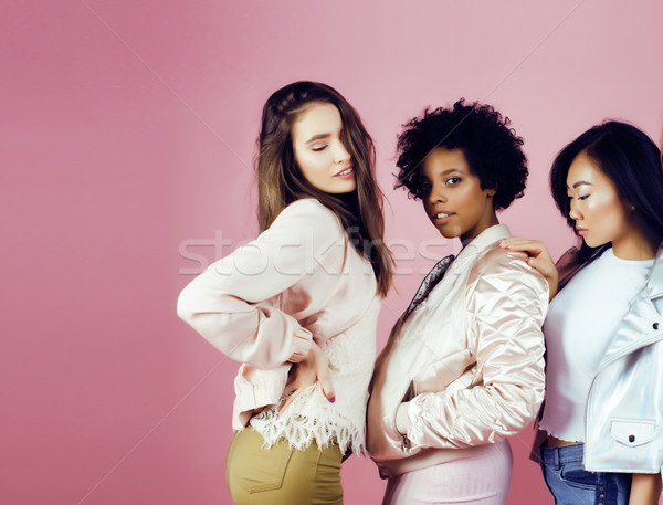 different nation girls with diversuty in skin, hair. Asian, scandinavian, african american cheerful  Stock photo © iordani