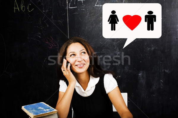 Stock photo: portrait of happy cute student in classroom at blackboard back t