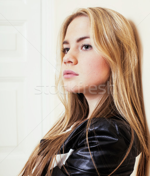 young pretty teenage blond girl sitting on floor at home despair Stock photo © iordani