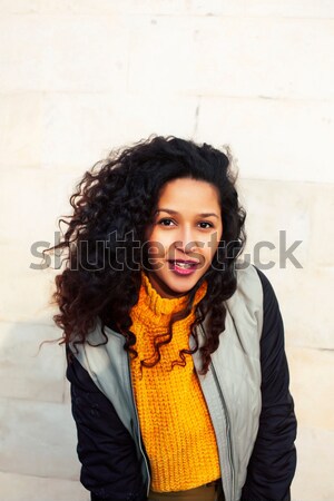 young pretty african american girl teenage outside on street, looking like real junky, social issues Stock photo © iordani