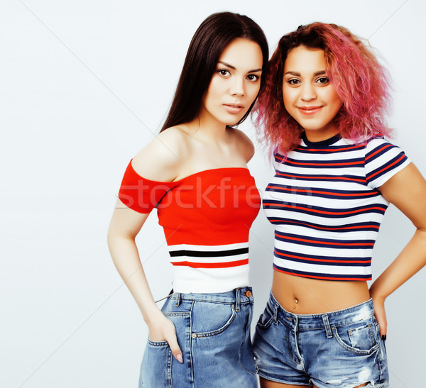 lifestyle people concept: two pretty stylish modern hipster teen girl having fun together, diverse n Stock photo © iordani