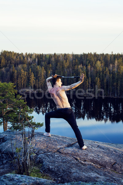 middle age man doing sport yoga on the top of the mountain, lifestyle people outdoor, summer wild na Stock photo © iordani