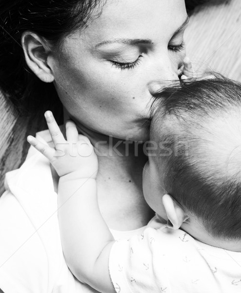 young brunette happy mother holding toddler baby son, breast-feeding concept, lifestyle modern peopl Stock photo © iordani