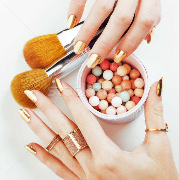 Nő kezek arany manikűr sok gyűrűk Stock fotó © iordani