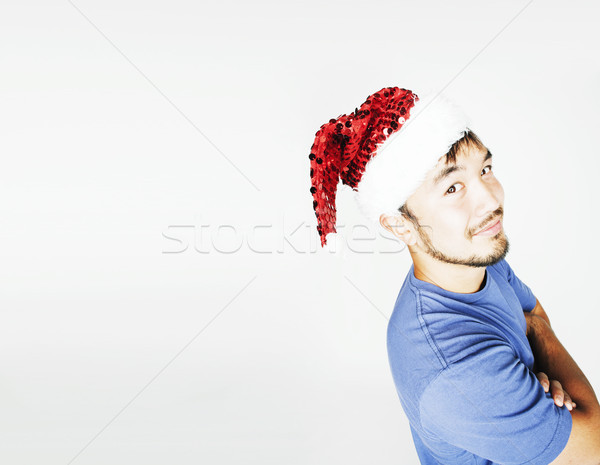 funy exotical asian Santa claus in new years red hat smiling Stock photo © iordani