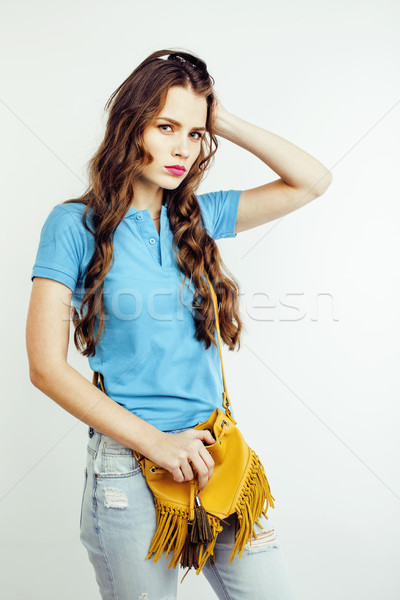 young pretty long hair woman happy smiling isolated on white background, wearing cute tiny handbag,  Stock photo © iordani