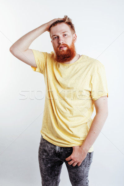 young handsome hipster bearded guy looking brutal isolated on white background, lifestyle people con Stock photo © iordani