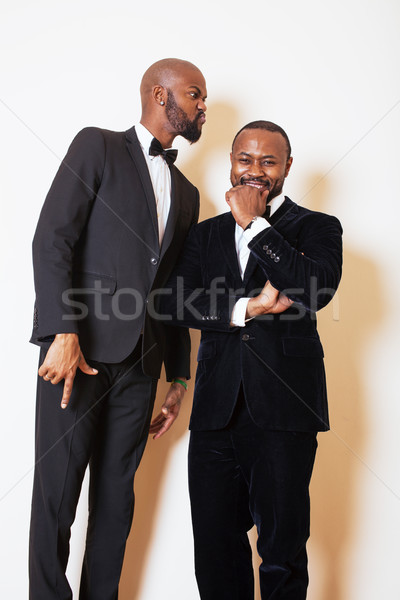 two afro-american businessmen in black suits emotional posing, g Stock photo © iordani
