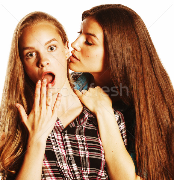 Stock photo: two cute teenagers having fun together isolated on white