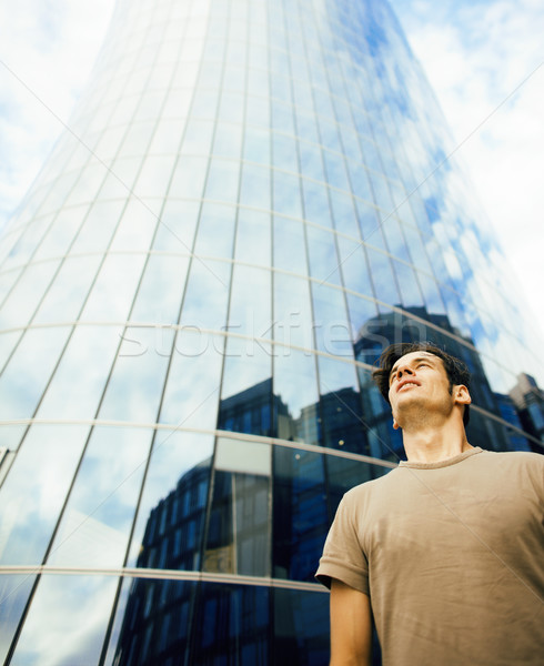 young man stand in front of modern business building Stock photo © iordani