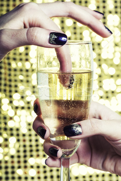 beauty close up photo fingers with manicure holding glass of champagne Stock photo © iordani