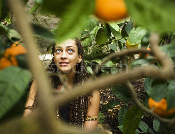 Genç sevimli gülümseyen kadın park portakal yaşam tarzı Stok fotoğraf © iordani