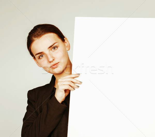 young pretty brunette girl with placard on white background wear Stock photo © iordani