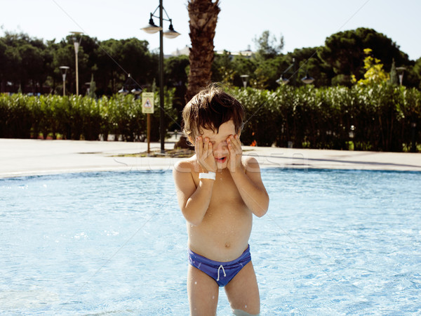little cute real boy in swimming pool close up smiling Stock photo © iordani