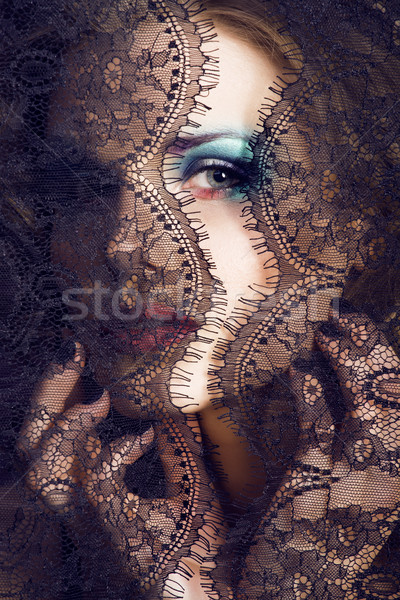 portrait of beauty young woman through lace close up mistery mak Stock photo © iordani