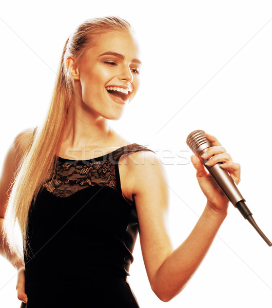 Foto stock: Jóvenes · bastante · rubio · mujer · cantando · micrófono