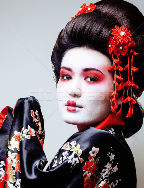 Giovani bella geisha nero kimono sakura Foto d'archivio © iordani