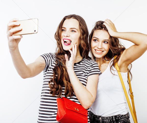 best friends teenage girls together having fun, posing emotional on white background, besties happy  Stock photo © iordani