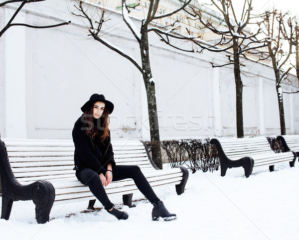young pretty modern hipster girl waiting on bench at winter snow park alone, lifestyle people concep Stock photo © iordani