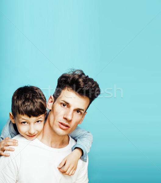 young pretty man model with little cute son playing together, lifestyle modern people concept, famil Stock photo © iordani