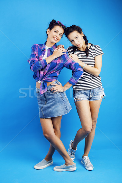 best friends teenage girls together having fun, posing emotional on blue background, besties happy s Stock photo © iordani