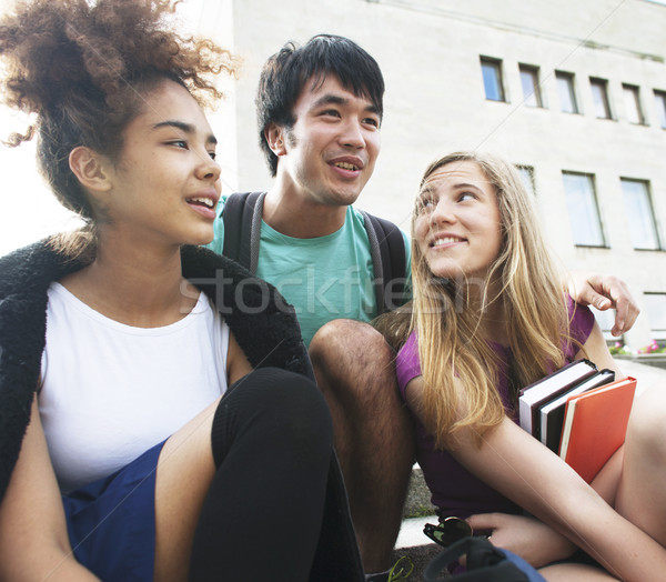 cute group teenages at the building of university Stock photo © iordani