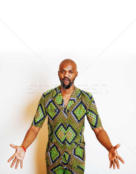 portrait of young handsome african man wearing bright green nati Stock photo © iordani