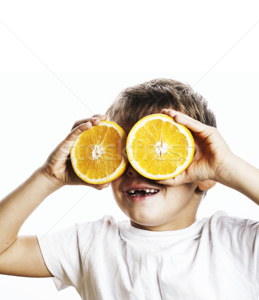 little cute boy with orange fruit double isolated on white smili Stock photo © iordani