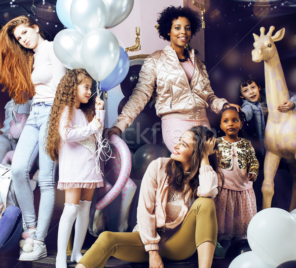 Lifestyle and people concept: young pretty diversity nations woman with different age children celeb Stock photo © iordani