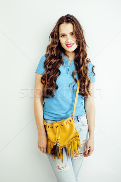 Stock photo: young pretty long hair woman happy smiling isolated on white background, wearing cute tiny handbag, 