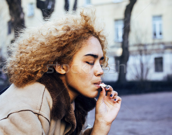 young pretty girl teenage outside smoking cigarette close up, lo Stock photo © iordani