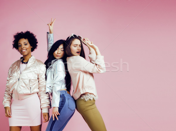 different nation girls with diversuty in skin, hair. Asian, scandinavian, african american cheerful  Stock photo © iordani