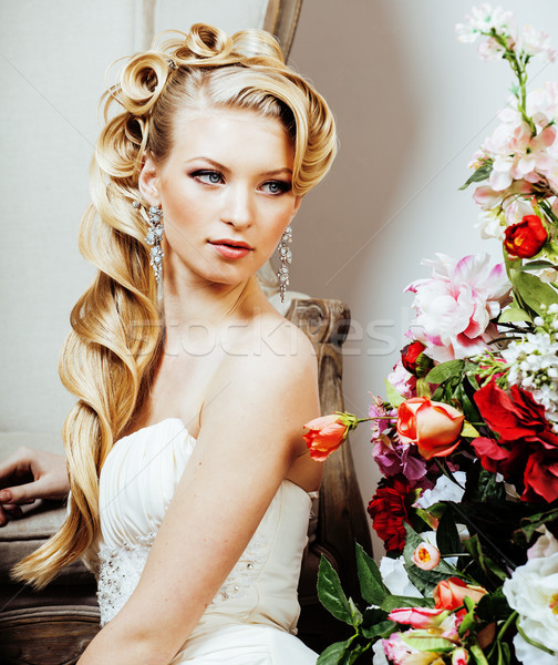 Stock photo: beauty young blond woman bride alone in luxury vintage interior with a lot of flowers 