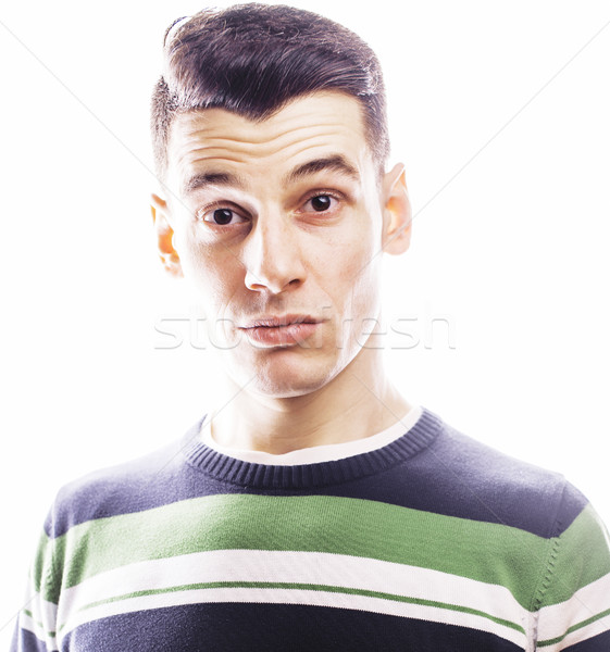 Portrait of a smart serious young man standing against white bac Stock photo © iordani