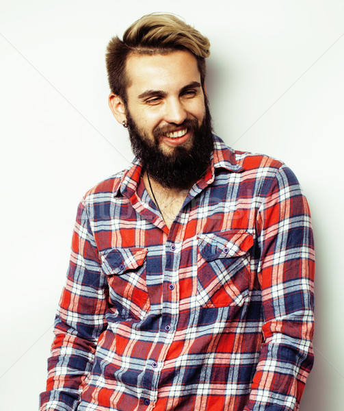 portrait of young bearded hipster guy smiling on white background close up, brutal modern man Stock photo © iordani