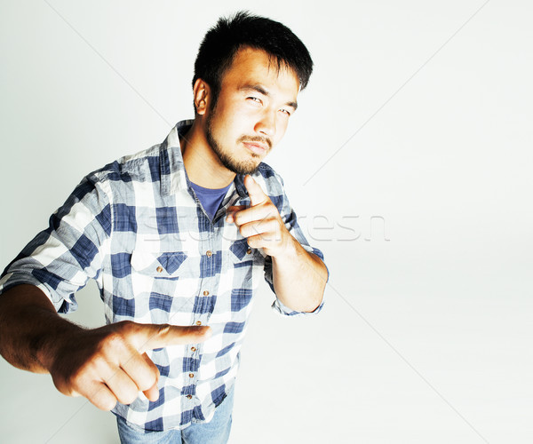 young cute asian man on white background gesturing emotional, po Stock photo © iordani