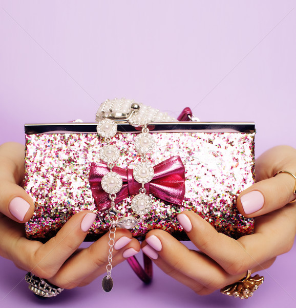 little girl stuff for princess, woman hands holding small cute handbag with jewelry and manicure, lu Stock photo © iordani