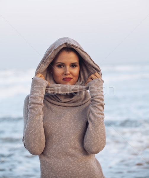young pretty woman in sweater at seacoast walking relaxing Stock photo © iordani