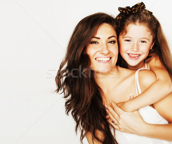 young mother with little cute daughter emotional posing on white Stock photo © iordani