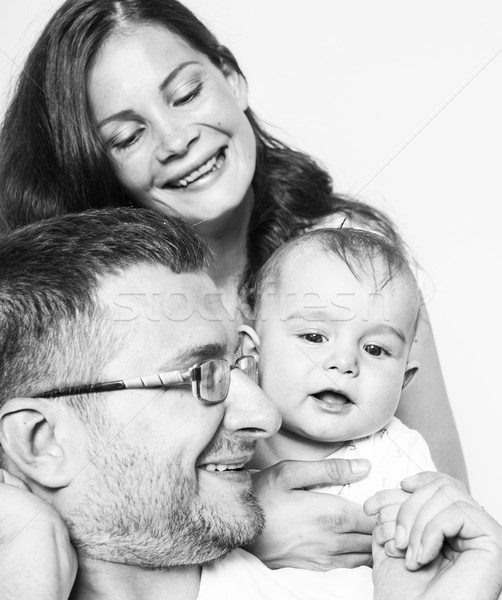 Stock photo: young happy modern family smiling together at home. lifestyle people concept, father holding baby so