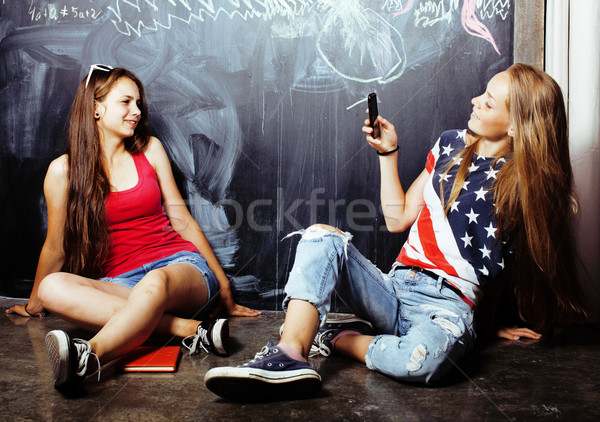 back to school after summer vacations, two teen real girls in classroom with blackboard painted toge Stock photo © iordani