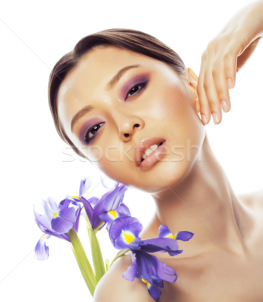 Tineri destul de asiatic femeie floare violet Imagine de stoc © iordani