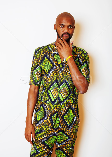 portrait of young handsome african man wearing bright green nati Stock photo © iordani