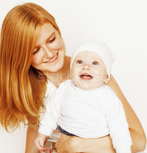 Stock photo: young beauty mother with cute baby, red head happy modern family smiling isolated on white backgroun