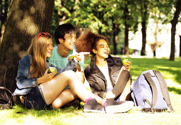 cute group of teenages at the building of university with books  Stock photo © iordani