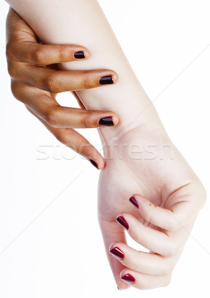 two different nathion manicured hands on white isolated, african Stock photo © iordani